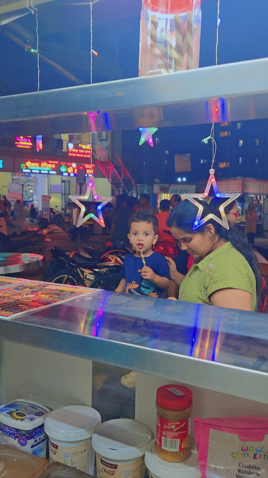 Family moment with a child enjoying a treat at Waffle Shauffle