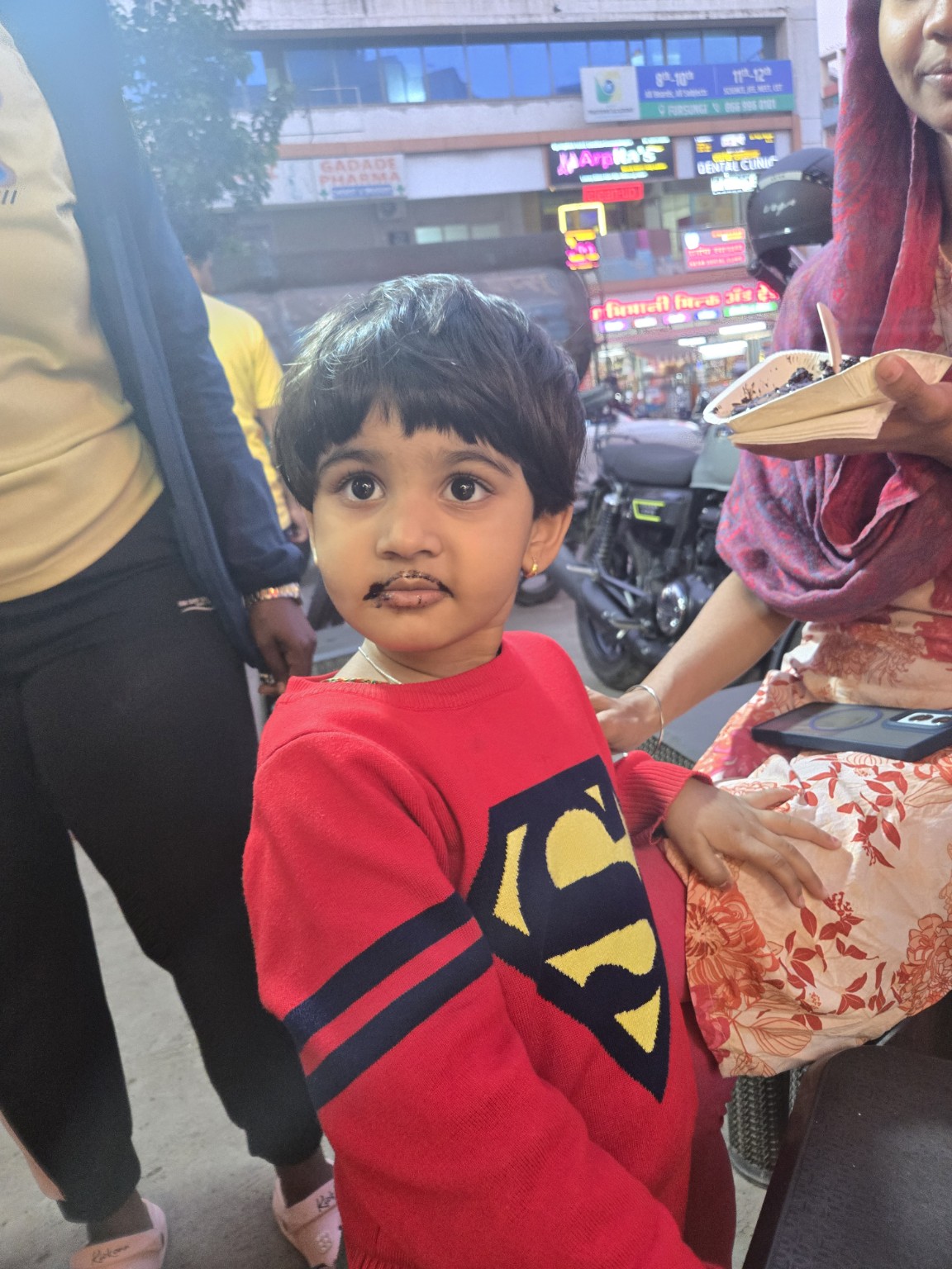 Young child enjoying chocolate at Waffle Shauffle